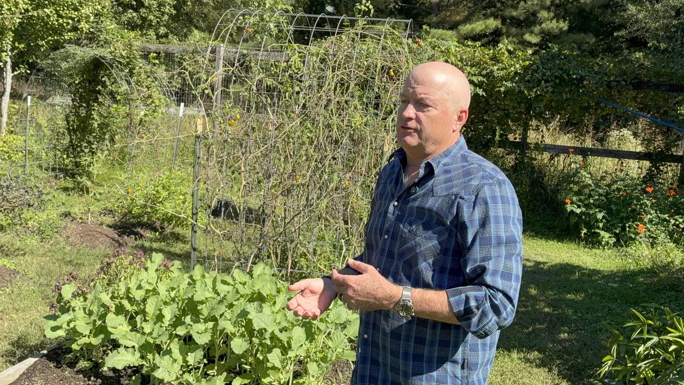 Dr. Maurice Werness speaking in his garden near Durham